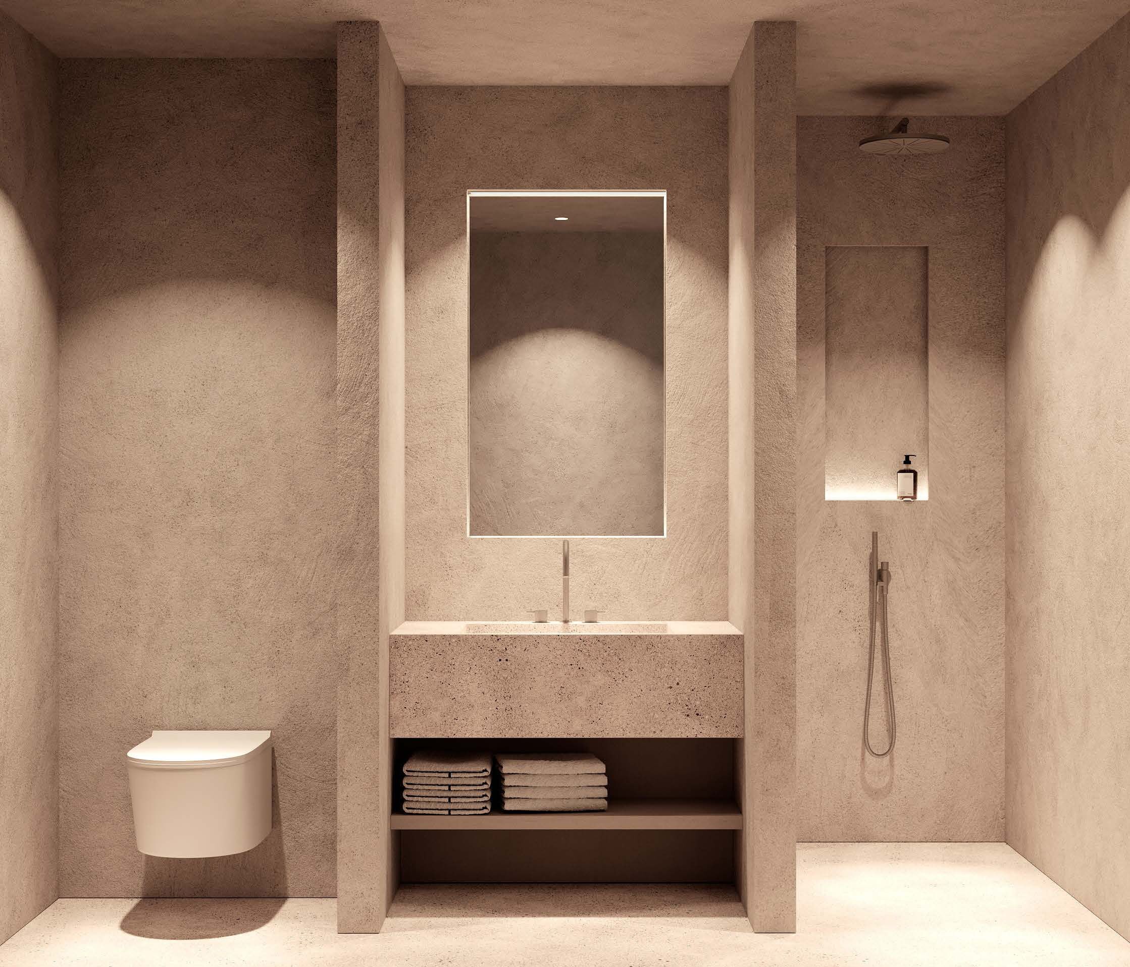 Een moderne badkamer met een ingebouwd toilet, een spiegel, een plank met opgevouwen handdoeken en een douche.