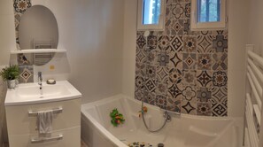 Shower, hair dryer, towels, toilet paper