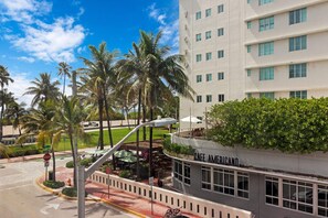 Experience the charm of our hotel's contemporary design, surrounded by lush palm trees and a beautifully manicured lawn.
