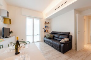 21-inch flat-screen TV with cable channels, TV