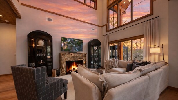 A spacious living room with a fireplace, a large window with a view, and a high ceiling. - *Blue Turtle*Lux~Lake~Outdoor Life~Bike~Kayak~Dogs (Blue Ridge)