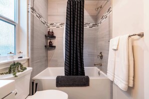 Shower, hair dryer, towels, soap