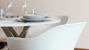 A white dining table with a bowl and glasses. - Italianway - Campania 26 A (Milan)