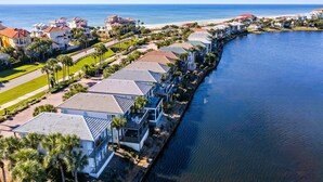 A coastal residential area with houses along a waterfront, featuring a long, narrow body of water. - Waterfront Villa*Steps to Beach*Pool*King Beds (Destin)