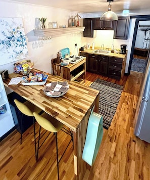 Fridge, microwave, stovetop, coffee/tea maker