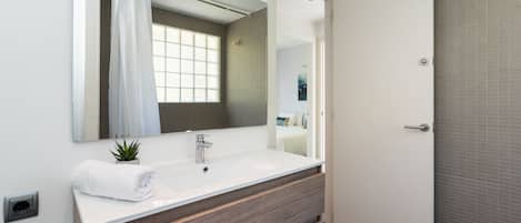 Shower, hair dryer, towels, toilet paper