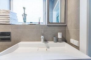 Hair dryer, towels, soap, shampoo