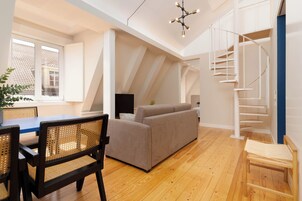 Two-Bedroom Apartment | Living area | 55-inch flat-screen TV with cable channels