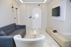 Deluxe Suite, 1 Bedroom | Living area | Printers - Golden House  (New Cairo)