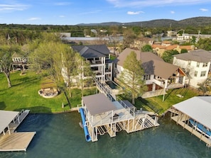 A residential area with houses, a dock, and a water body.