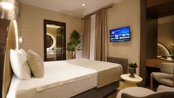 Quarto solteiro standard | Roupas de cama premium, Wi-Fi de cortesia