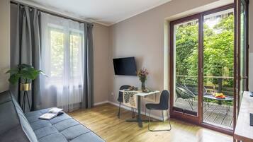 Executive Apartment | Blackout drapes, iron/ironing board, free WiFi