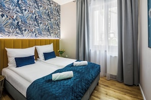 Apartamento luxo | Cortinas blackout, ferros/tábuas de passar roupa, Wi-Fi de cortesia