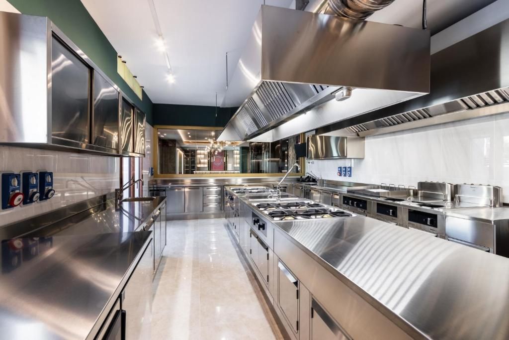 A modern kitchen with stainless steel appliances and a central island.