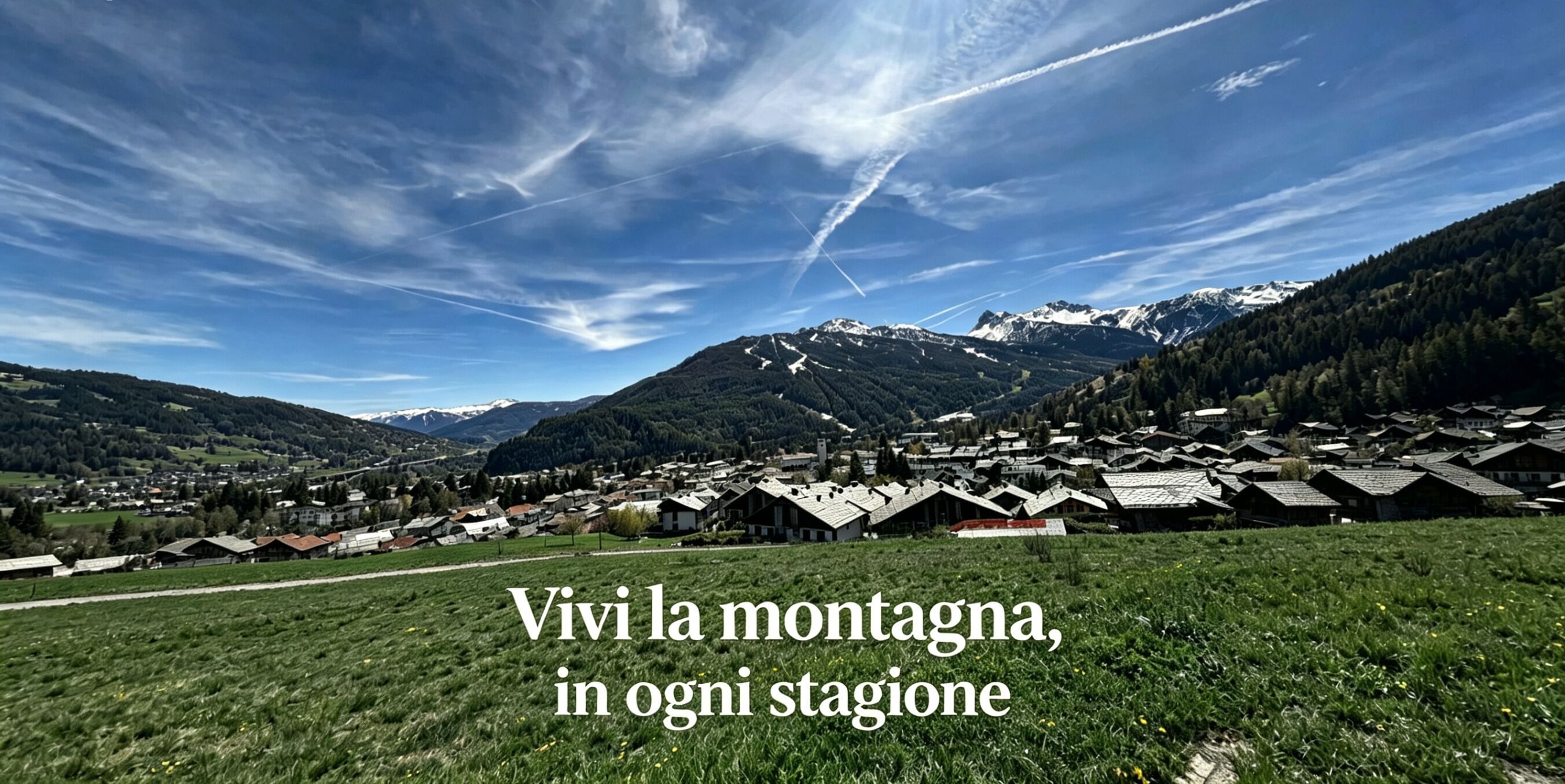 A mountainous village with traditional houses and a clear sky.