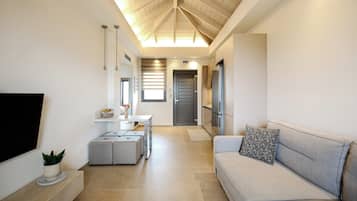 Deluxe Apartment, Sea View | Living area | TV