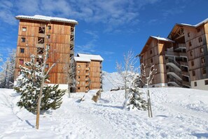 Experience the rustic charm of this ski resort, offering accommodations with balconies and a unique blend of natural and modern architecture.