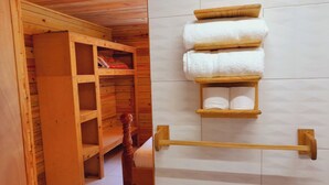 A wooden closet with shelves and a wooden stool. - Tranquility Suite- Cottage 7 (Pointe Michel)