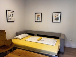 Design Apartment | Living area | 90-cm flat-screen TV with cable channels
