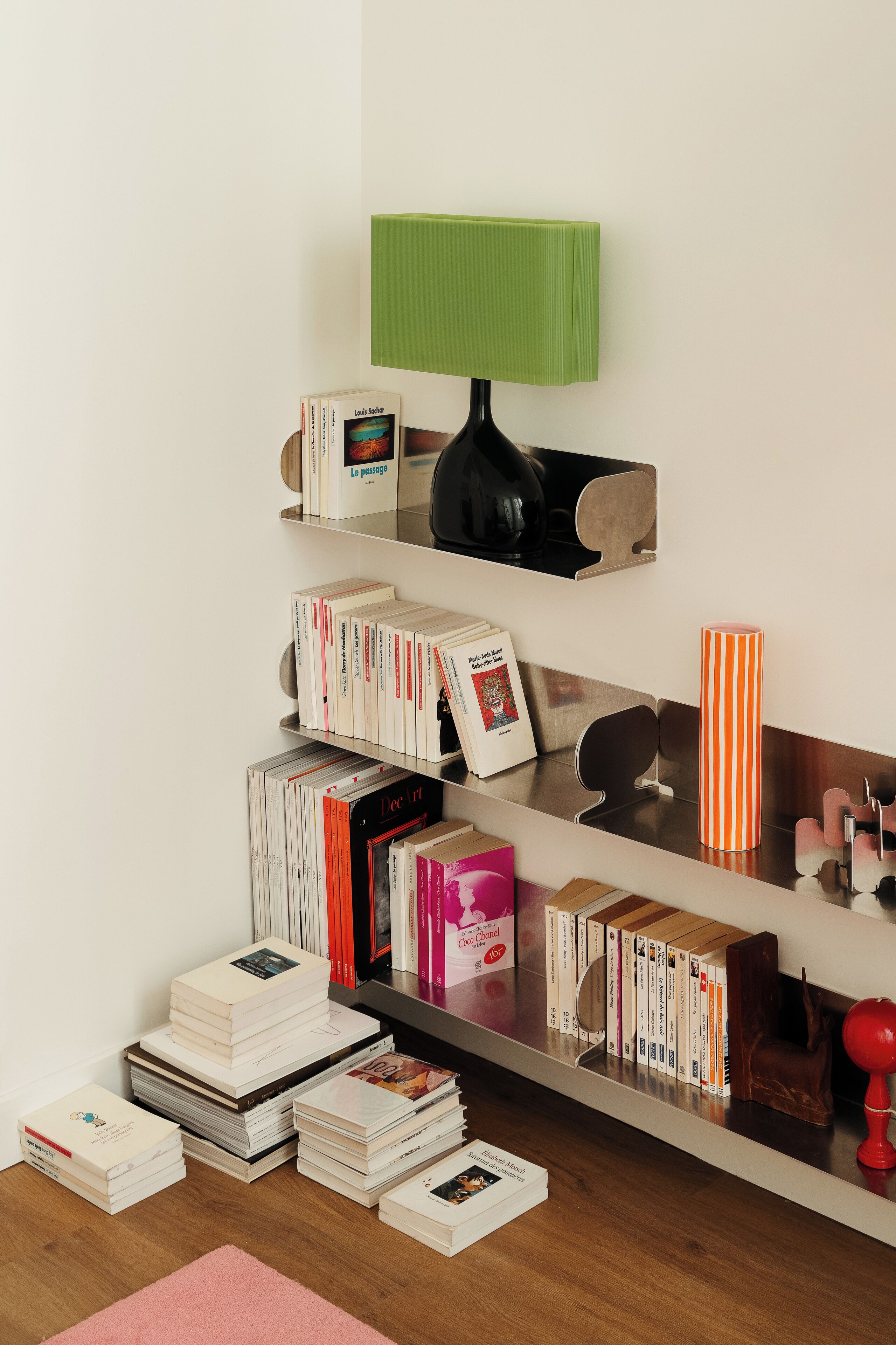 A bookshelf with books and decorative items.