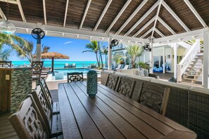 Outdoor dining - Zen Exuma: Stunning Beachfront Villa w/ NEW Rooftop Lounge, Spa, Cabana & Pool! (Moss Town)