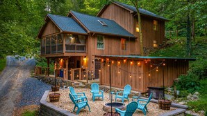 A wooden cabin with a deck, outdoor seating, and string lights. - Highland Cabin, pets ok/GW Nat'l Forest/near JMU (Hinton)