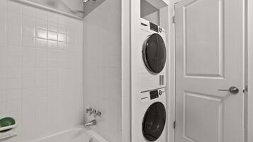 Shower, hair dryer, towels, shampoo
