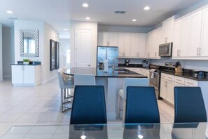 Dining - 7 miles to Disney. Spacious Villa with pool, spa, game room & Themed bedrooms.  (Kissimmee)
