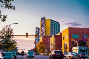 A busy urban street with traffic lights, cars, and a bus. - Trendy Studio in Prime South Philly Neighborhood (Philadelphia)