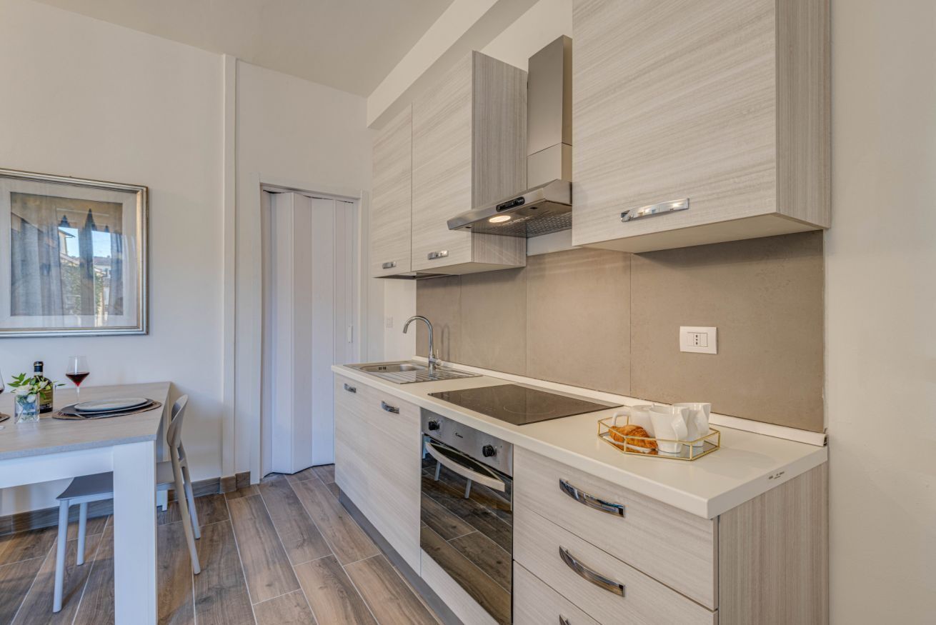 Fridge, stovetop, dishwasher, coffee/tea maker