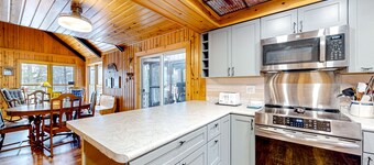 Lakefront dog-friendly retreat with sauna, dock, canoe, paddle board, & firepit