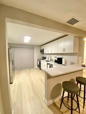 Apartment | Private kitchen | Stovetop, dishwasher, blender, cookware/dishes/utensils