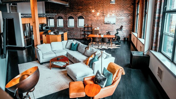A modern living space with a kitchen, dining area, and seating area. - Massive Downtown Seattle Loft - Free Parking Included!  (Seattle)