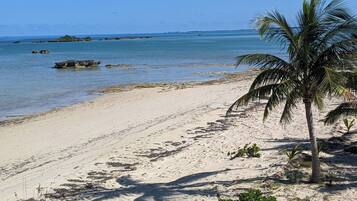 On the beach, sun loungers, beach towels