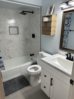 Shower, towels, soap, toilet paper