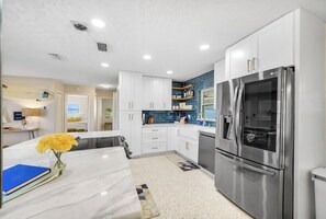 The kitchen is fully equipped for your stay. Just a friendly reminder, it features an electric stove. Avoid placing anything on top of it when not in use and allow it to cool before cleaning.