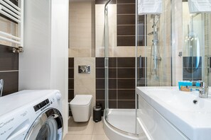 Shower, hair dryer, towels, soap