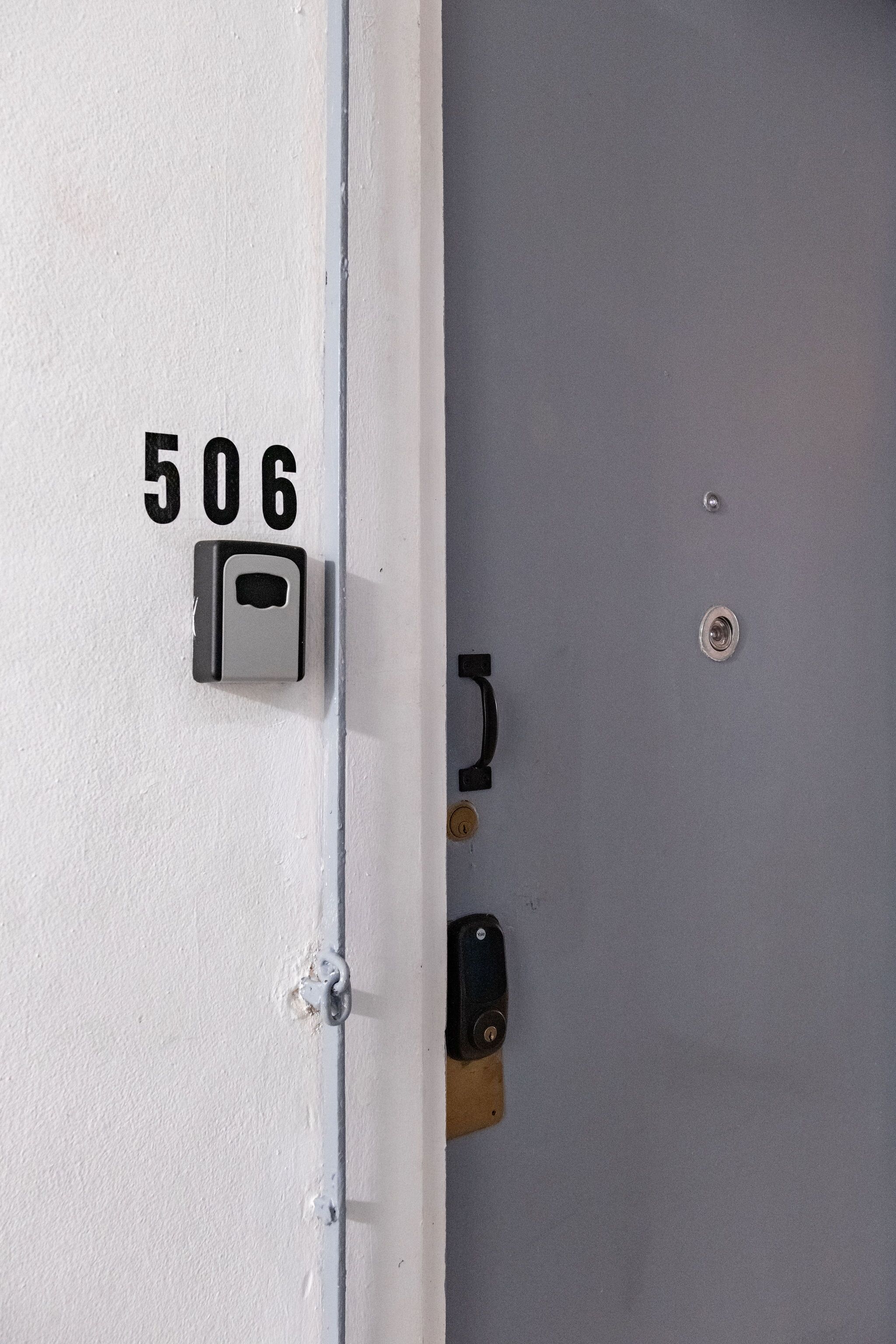 A door with the number 506, a keyhole, and a lock.