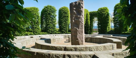 A stone monument surrounded by a circular stone pathway.