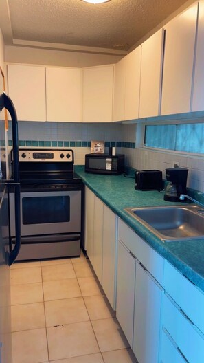Apartment, Ocean View | Private kitchen | Fridge, paper towels