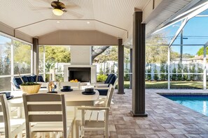 Outdoor dining - Luxury Home, Heated Saltwater Pool, 5-Min to the Beach! (Seminole)
