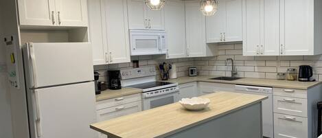 Coffee/tea maker, fridge, microwave, oven