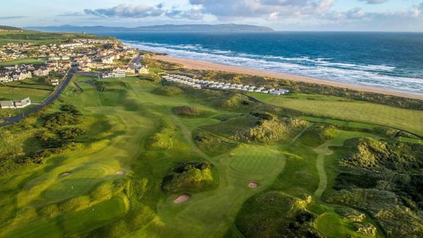 An aerial view of a coastal golf course with a beach and ocean in the background. - Castleshaw Holiday Home (Castlerock)