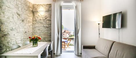 Panoramic Apartment | Living area | Flat-screen TV