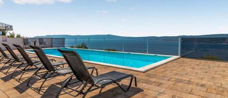 Apartment (Two Bedroom Apartment with Terrace an) | Pool | Seasonal outdoor pool, pool umbrellas, sun loungers