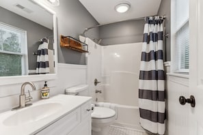 Shower, hair dryer, towels, shampoo