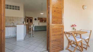 Traditional Apartment, Courtyard View | Living area | 24-inch LED TV with digital channels