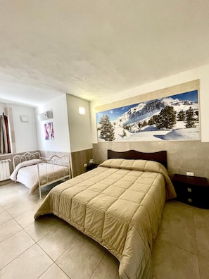 Kamar Keluarga | Seprai premium, bantalan ekstra lembut, dan minibar