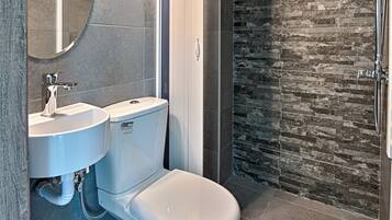 Shower, hair dryer, slippers, towels