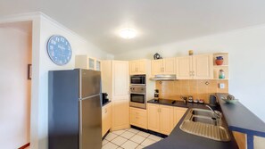 Fridge, microwave, oven, stovetop - La Riviera One Coastal Life Style Two Bedroom (South Mission Beach)